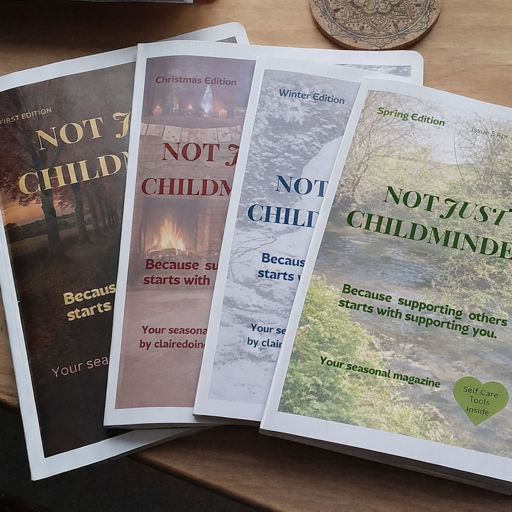 4 magazines laid flat on a table