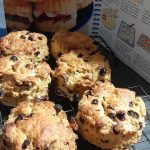 Homemade scones with raisins, freshly baked and ready to enjoy with jam and cream